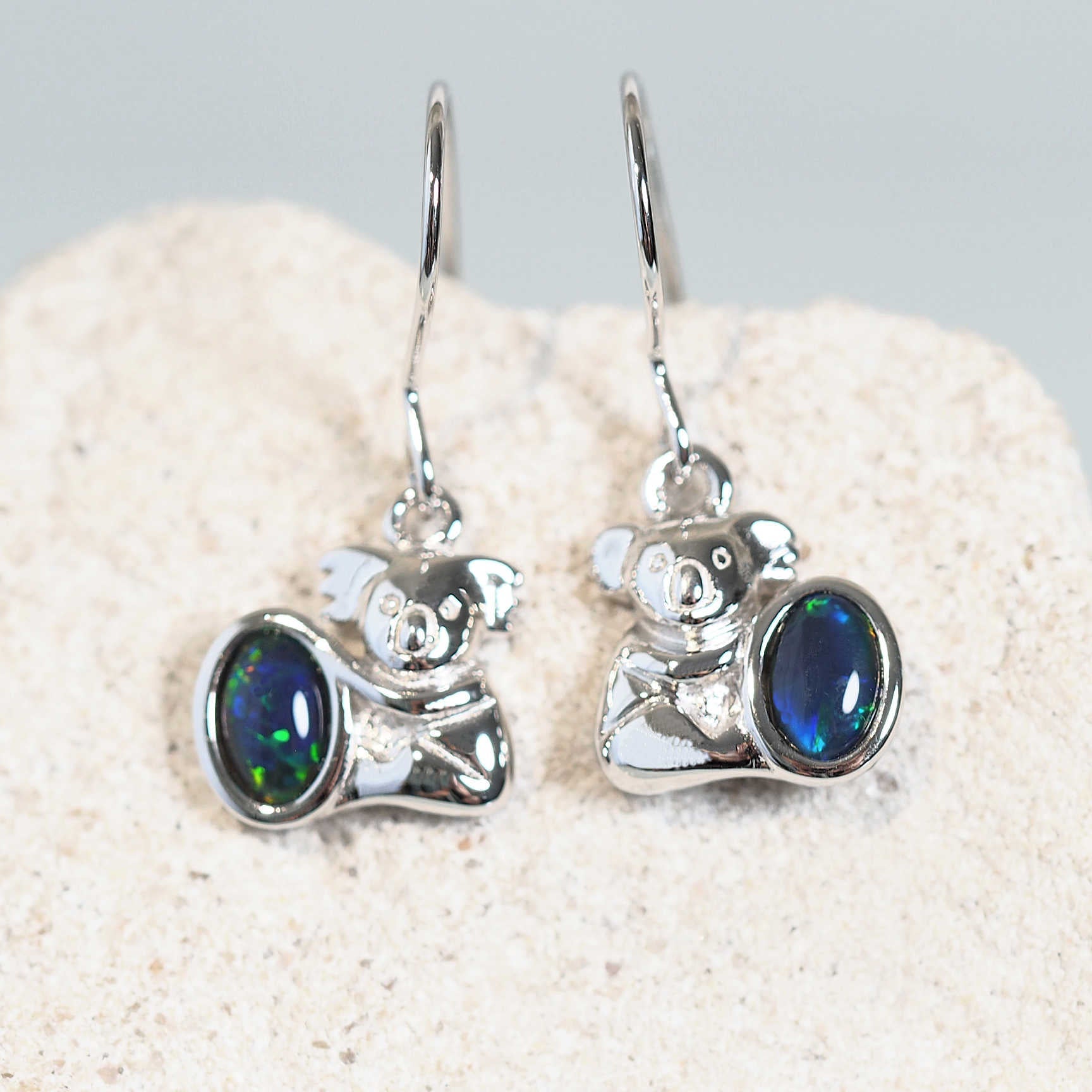 blue and green koala design opal earrings