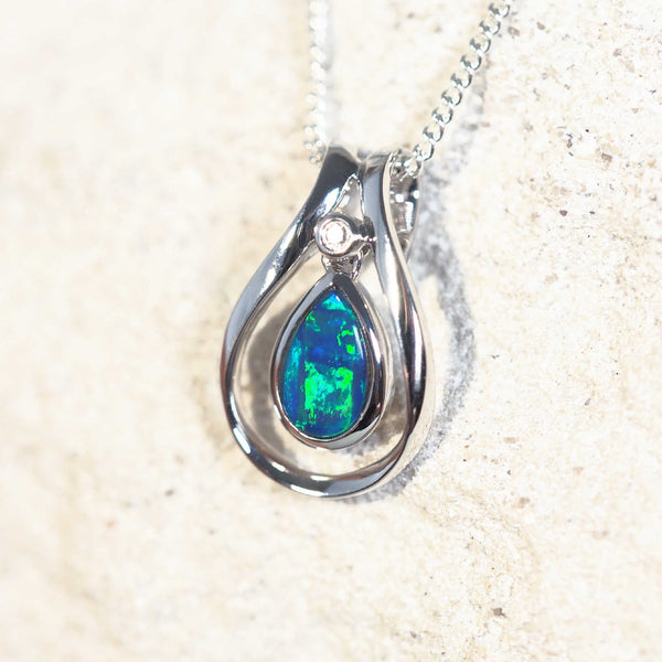 Elegant Lainey opal necklace with a teardrop-shaped Australian doublet opal bezel set in 14ct white gold and accented with a dazzling white diamond.