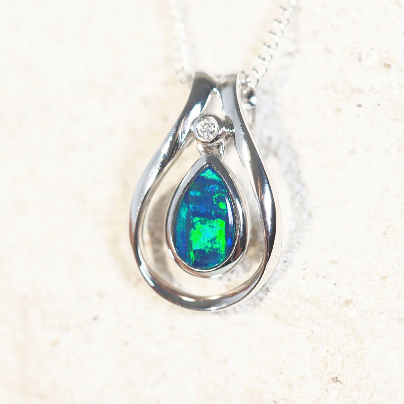 diamond and opal white gold pendant