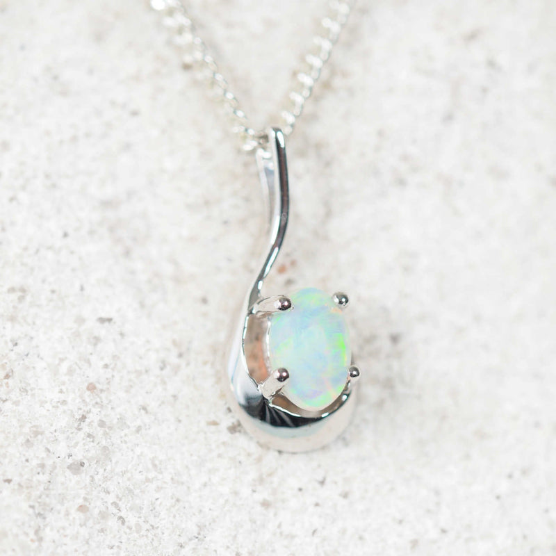 oval opal pendant set in 9ct white gold with a curved pendant