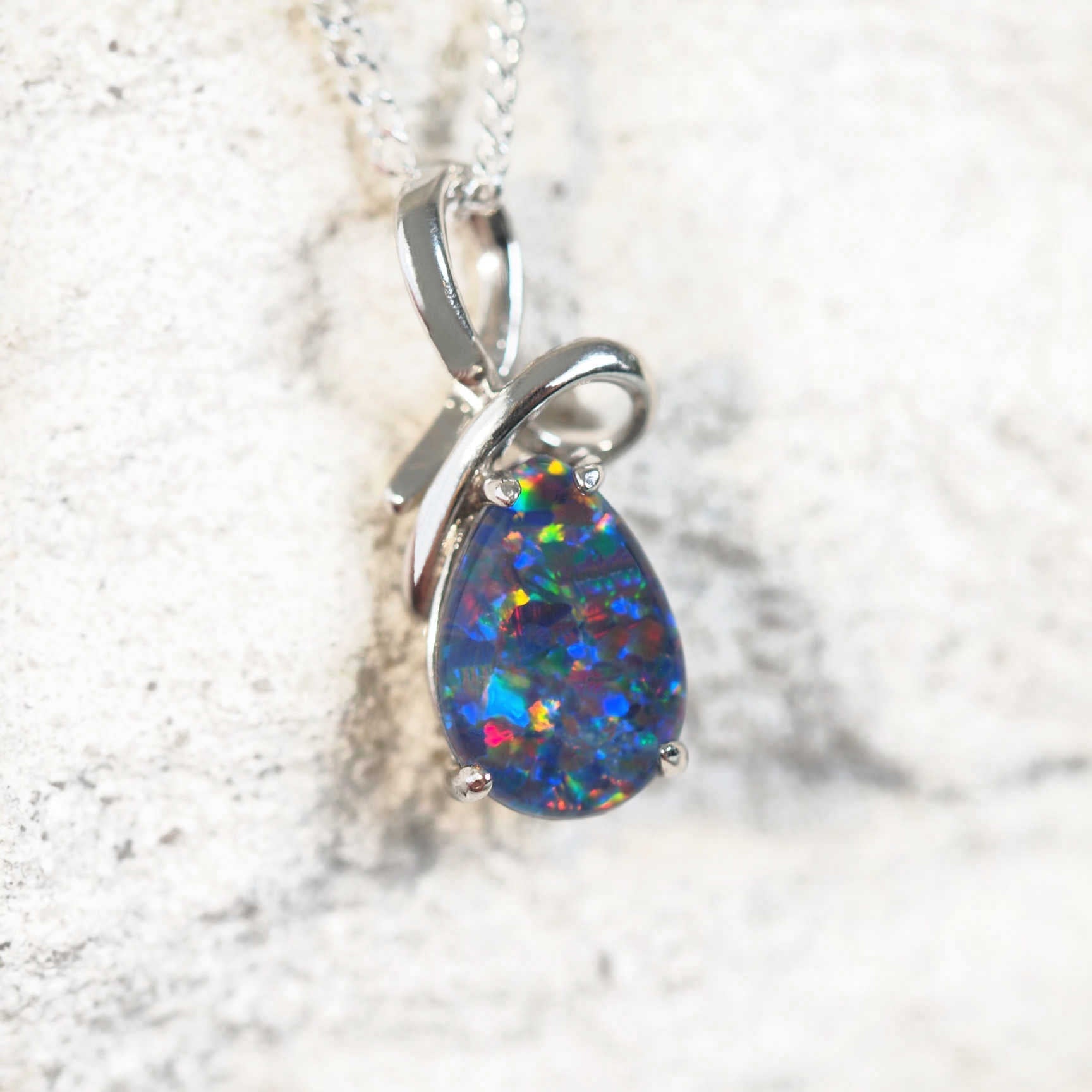 teardrop shape opal pendant in silver