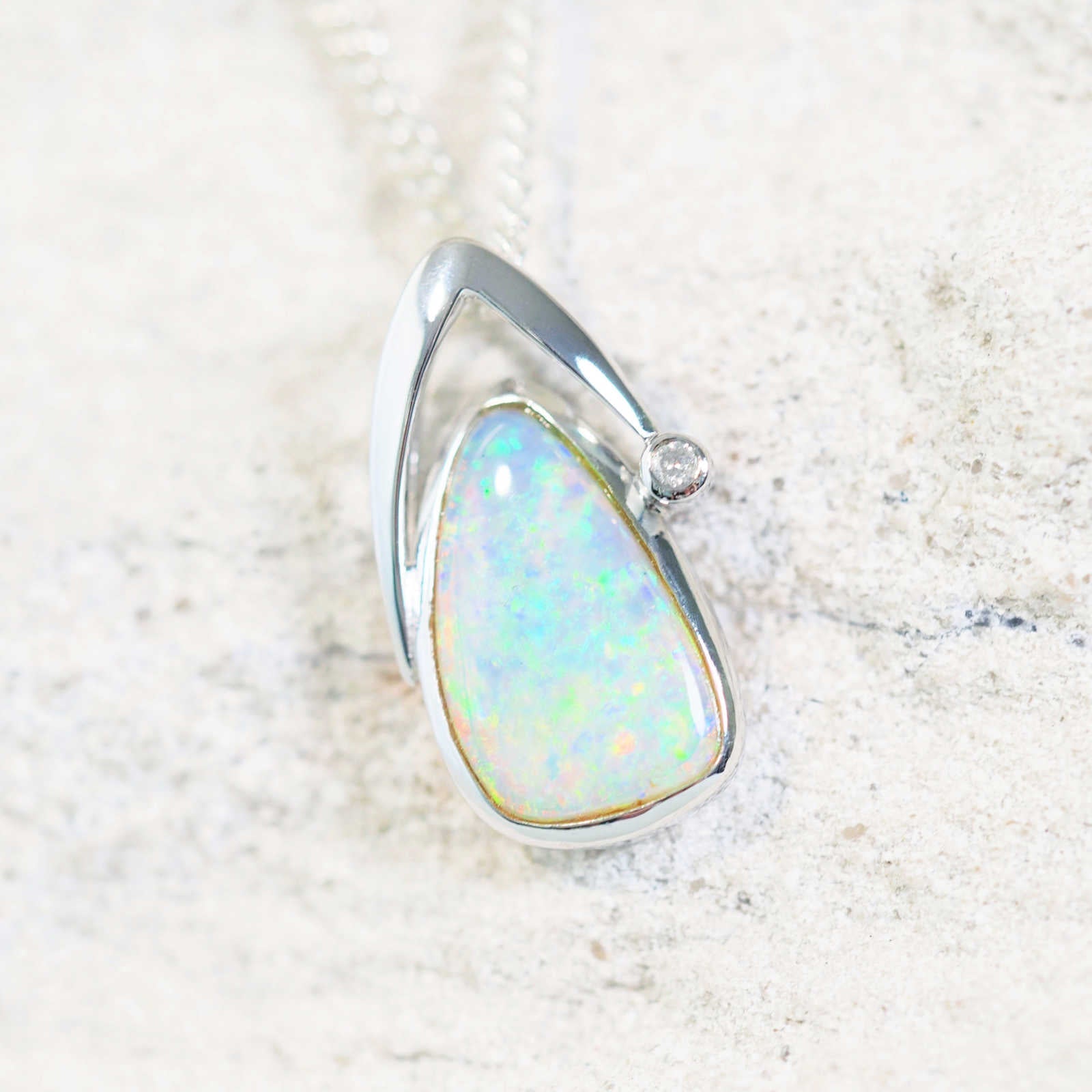 crystal opal pendant set in white gold