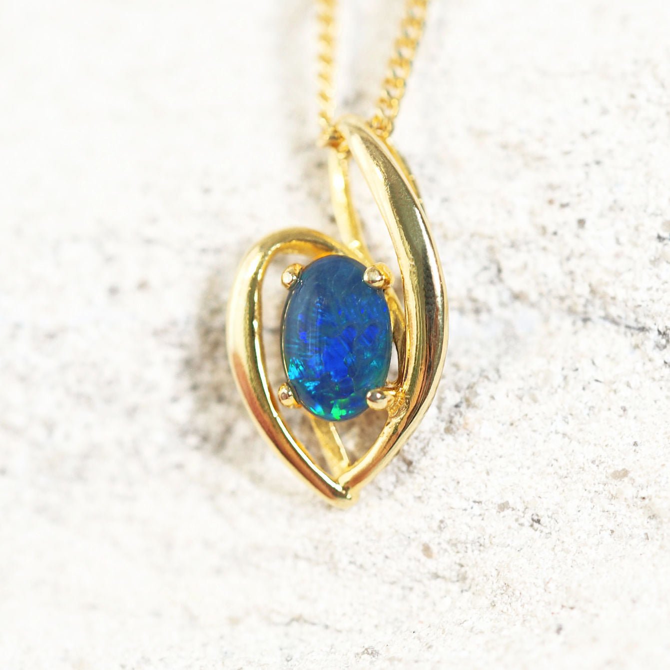 blue and green triplet opal pendant in gold plated silver