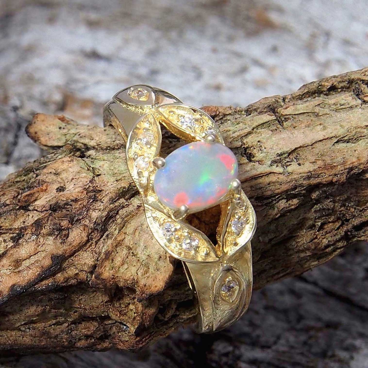 Gold plated sterling silver ornate design ring claw set with a beautiful South Australian multi-colour oval solid white opal and ten cubic zirconias