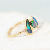 green and blue Lightning Ridge opal set in a trio gold ring