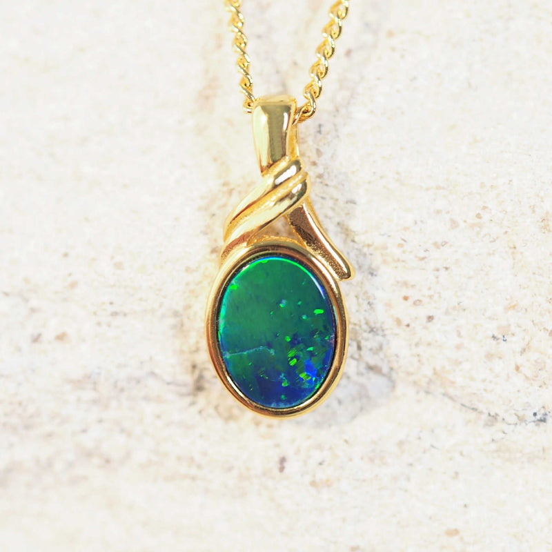 shimmery green and blue opal pendant set in gold plated silver