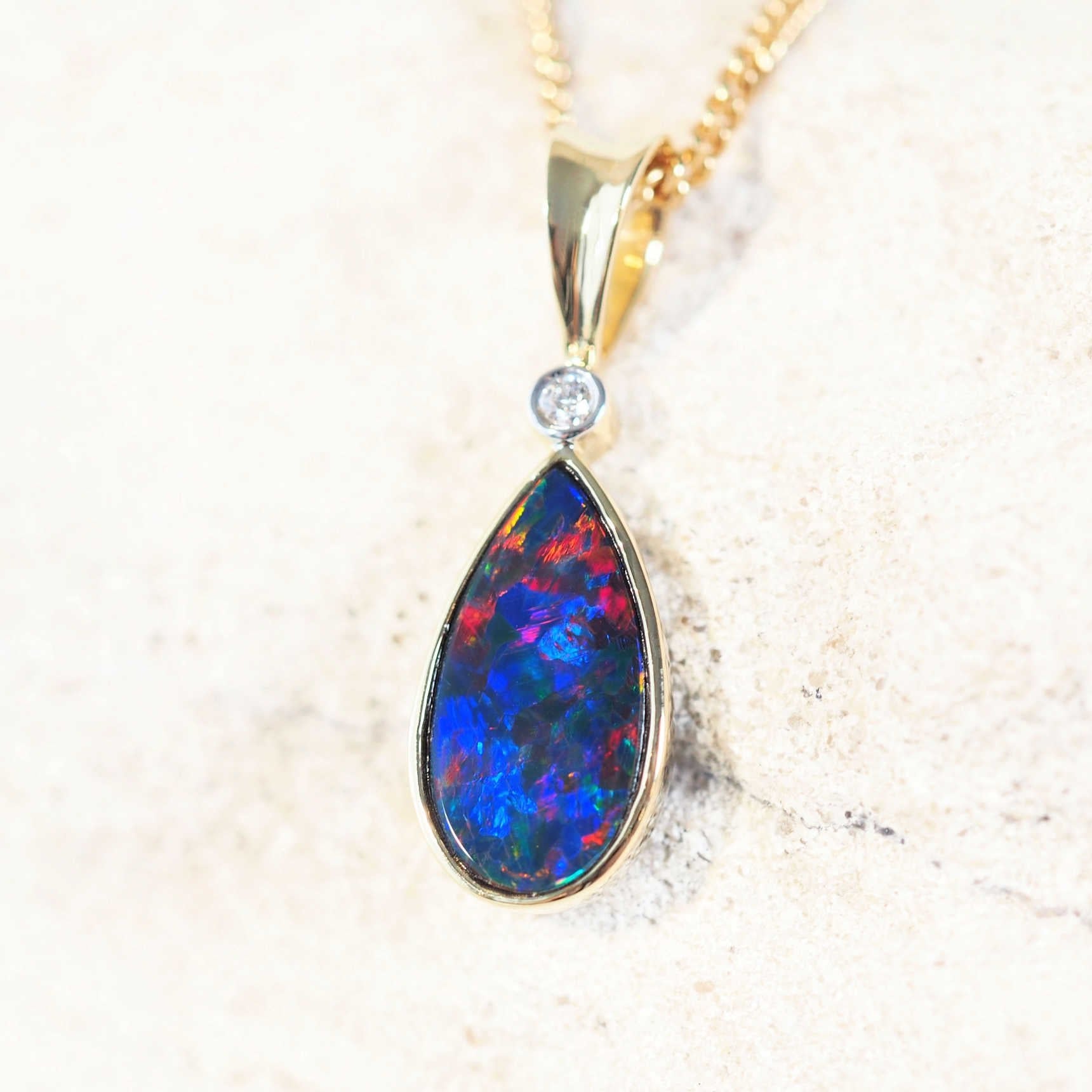 opal pendant set in 14ct gold with one diamond