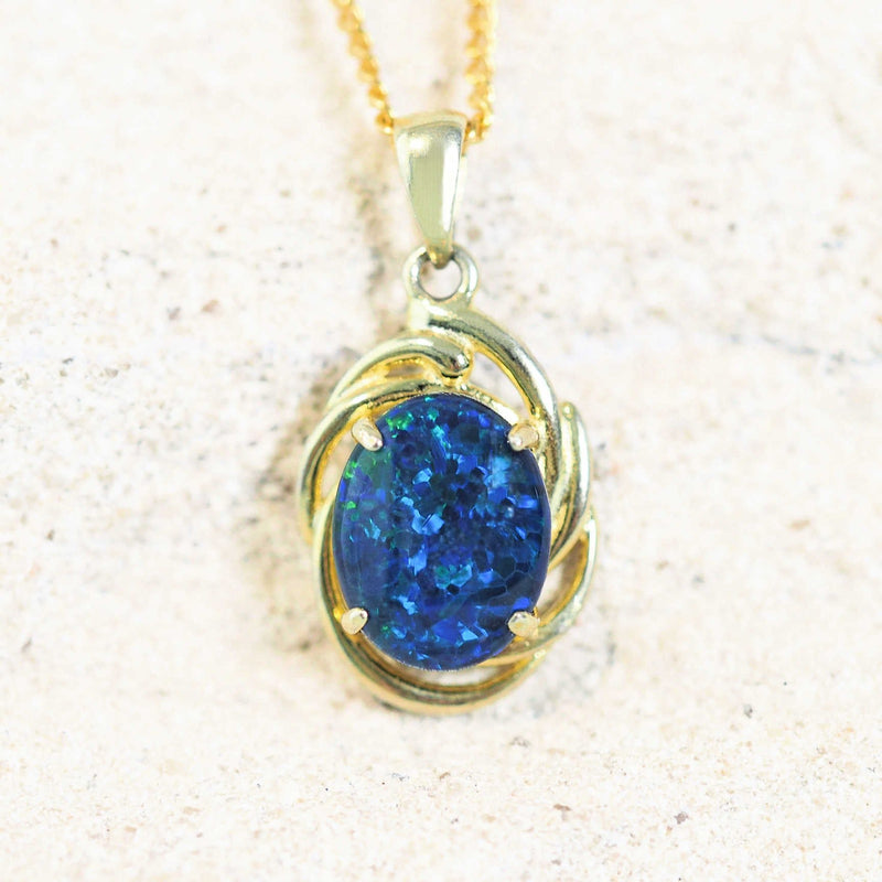 Gold-plated silver pendant featuring a vibrant blue opal gemstone