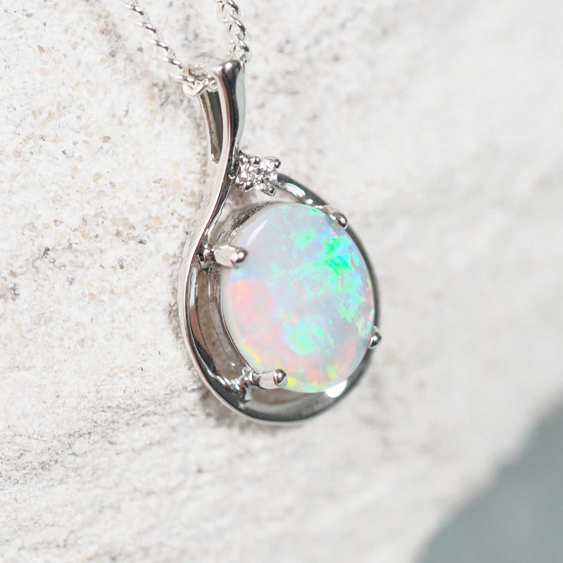 Elegant bezel-set opal necklace pendant in white gold