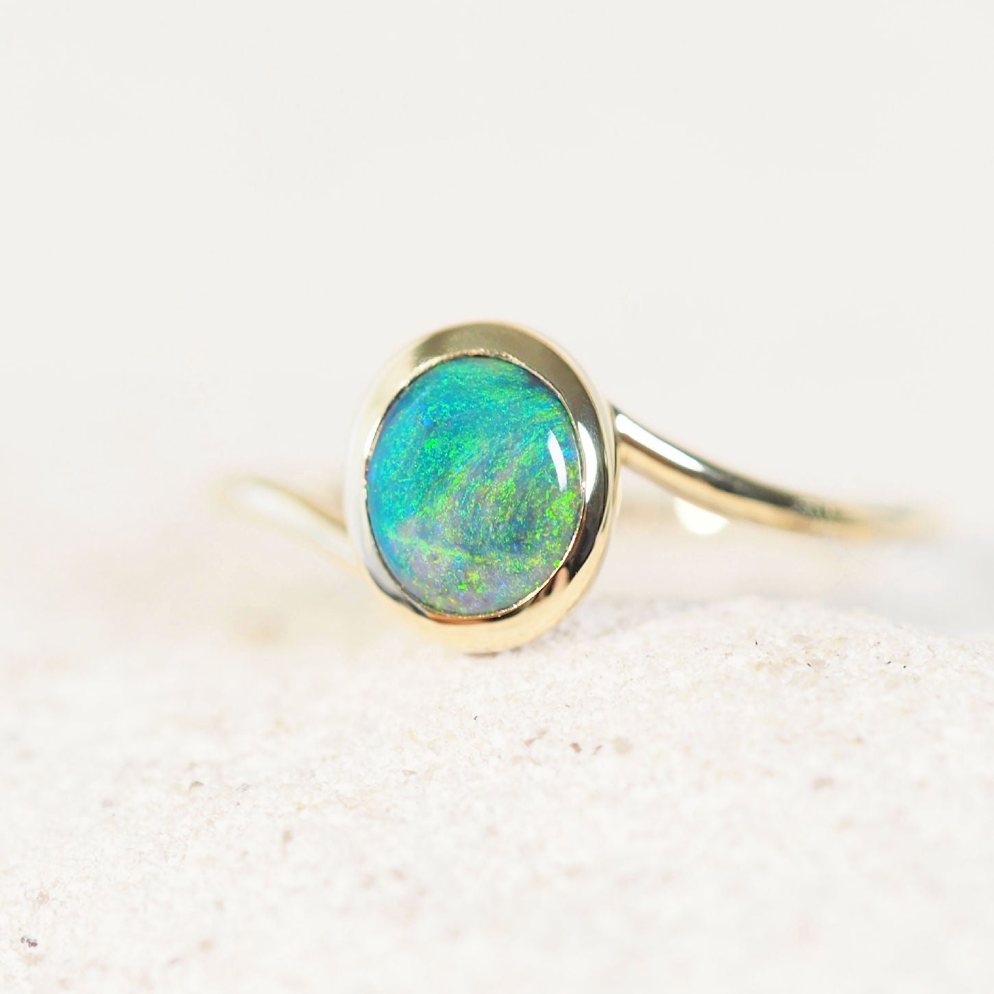 green coloured black opal ring set in gold