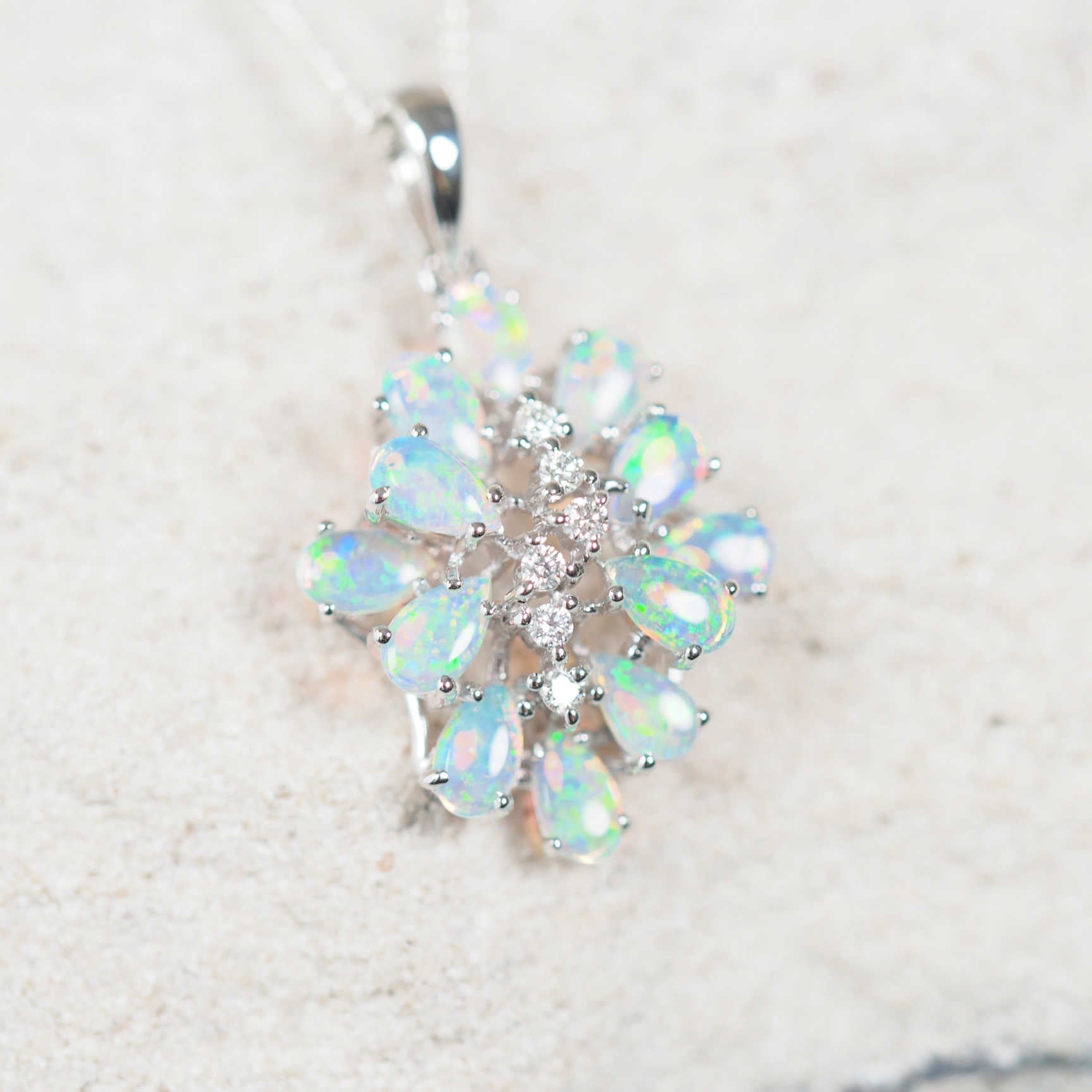 green and blue crystal opals set into a cluster pendant