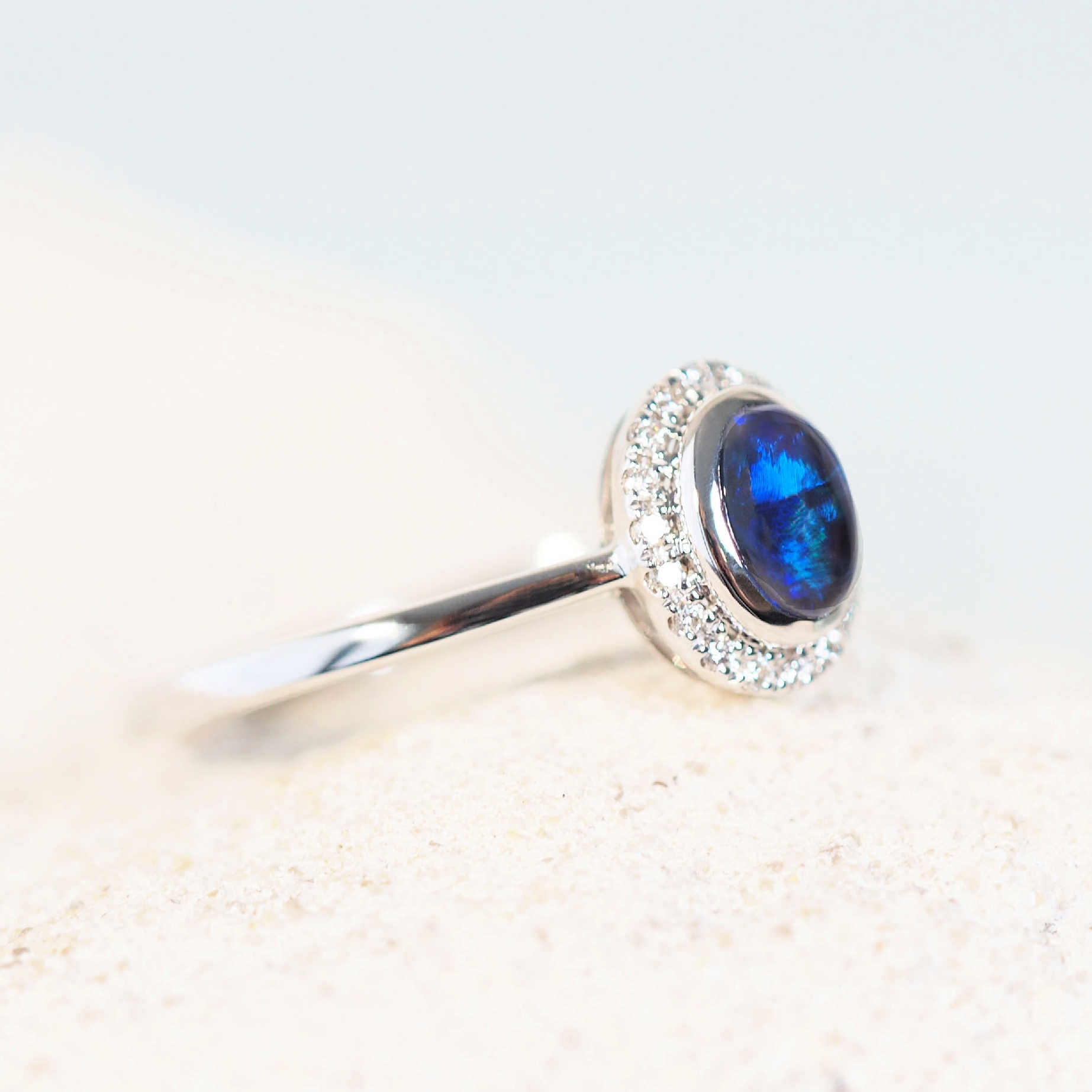 rich blue coloured opal ring set in white gold