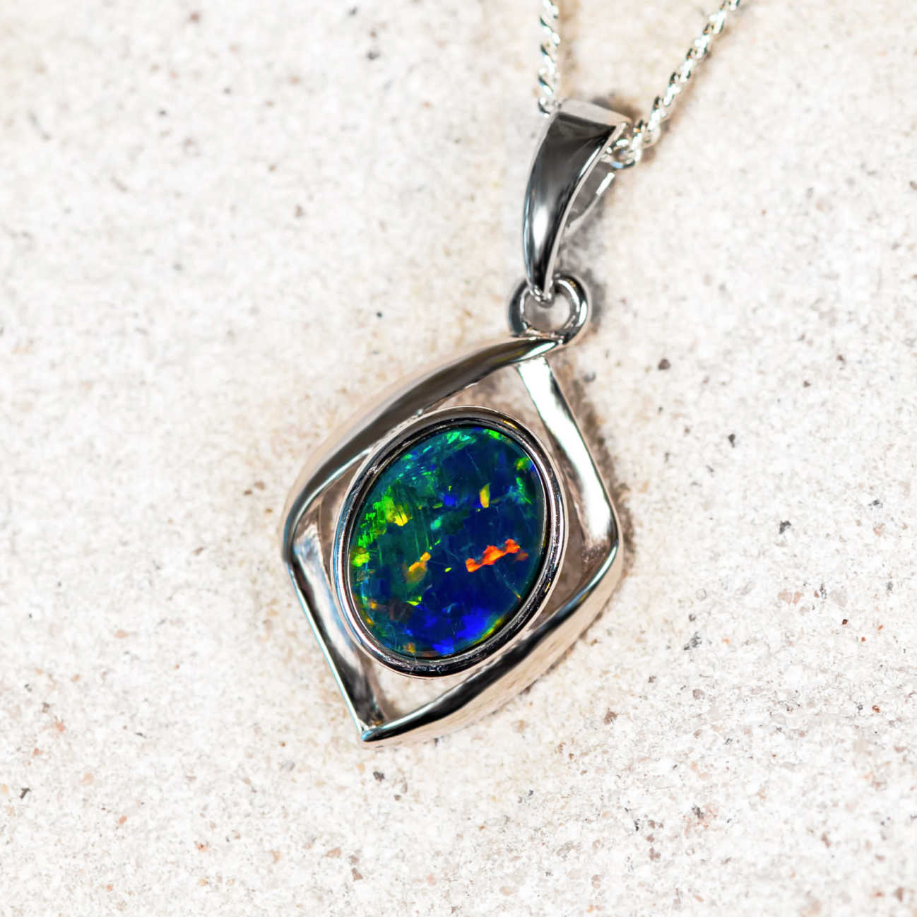 colourful opal pendant set in sterling silver