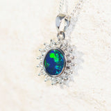 green and blue opal pendant set in white fold with diamonds