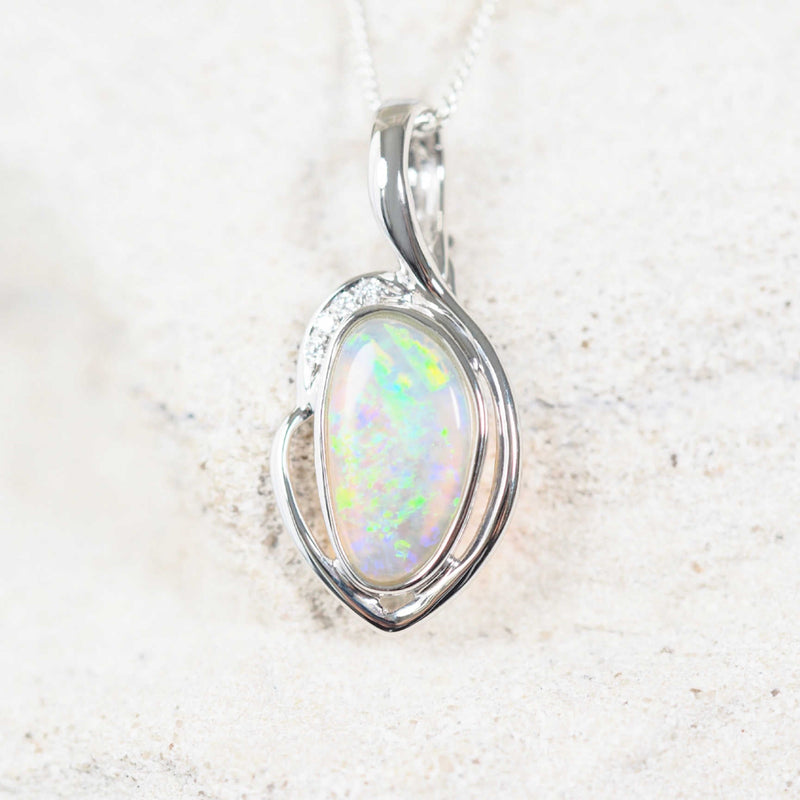 Elegant Ophelia opal necklace pendant with a vibrant green South Australian opal, bezel set in white gold with four sparkling white diamonds for added elegance.