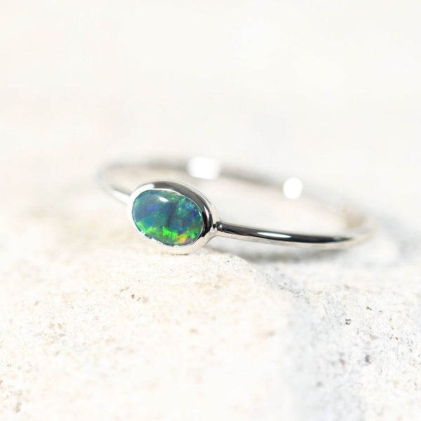 Lightning Ridge green opal ring set in white gold