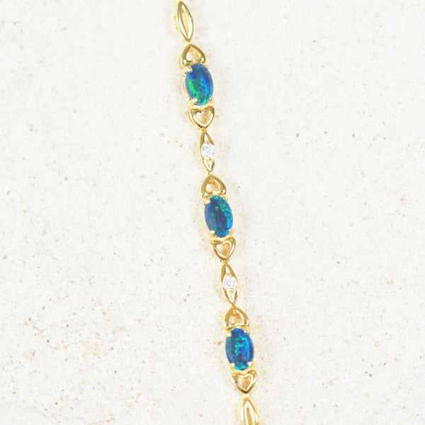 Gold-plated silver triplet opal bracelet featuring three blue and green opals