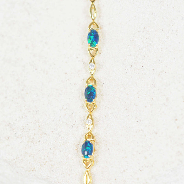 Gold-plated silver triplet opal bracelet featuring three stunning blue and green opals, elegantly set in a refined design, perfect for adding a touch of luxury and vibrant color to any look