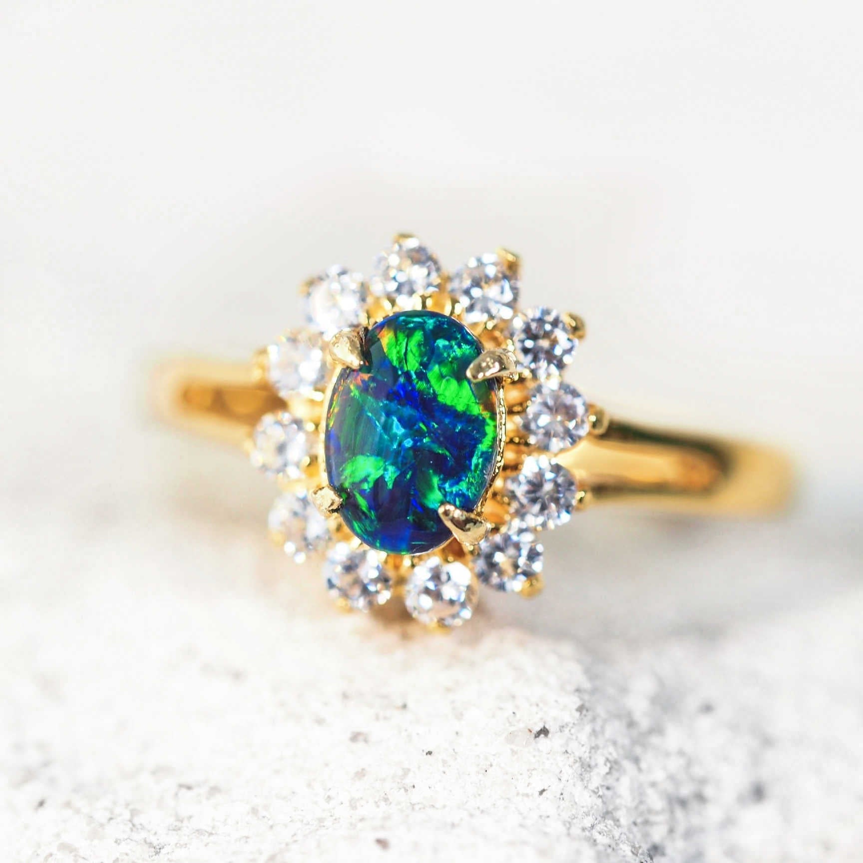 blue opal ring set in gold plated silver with diamantes