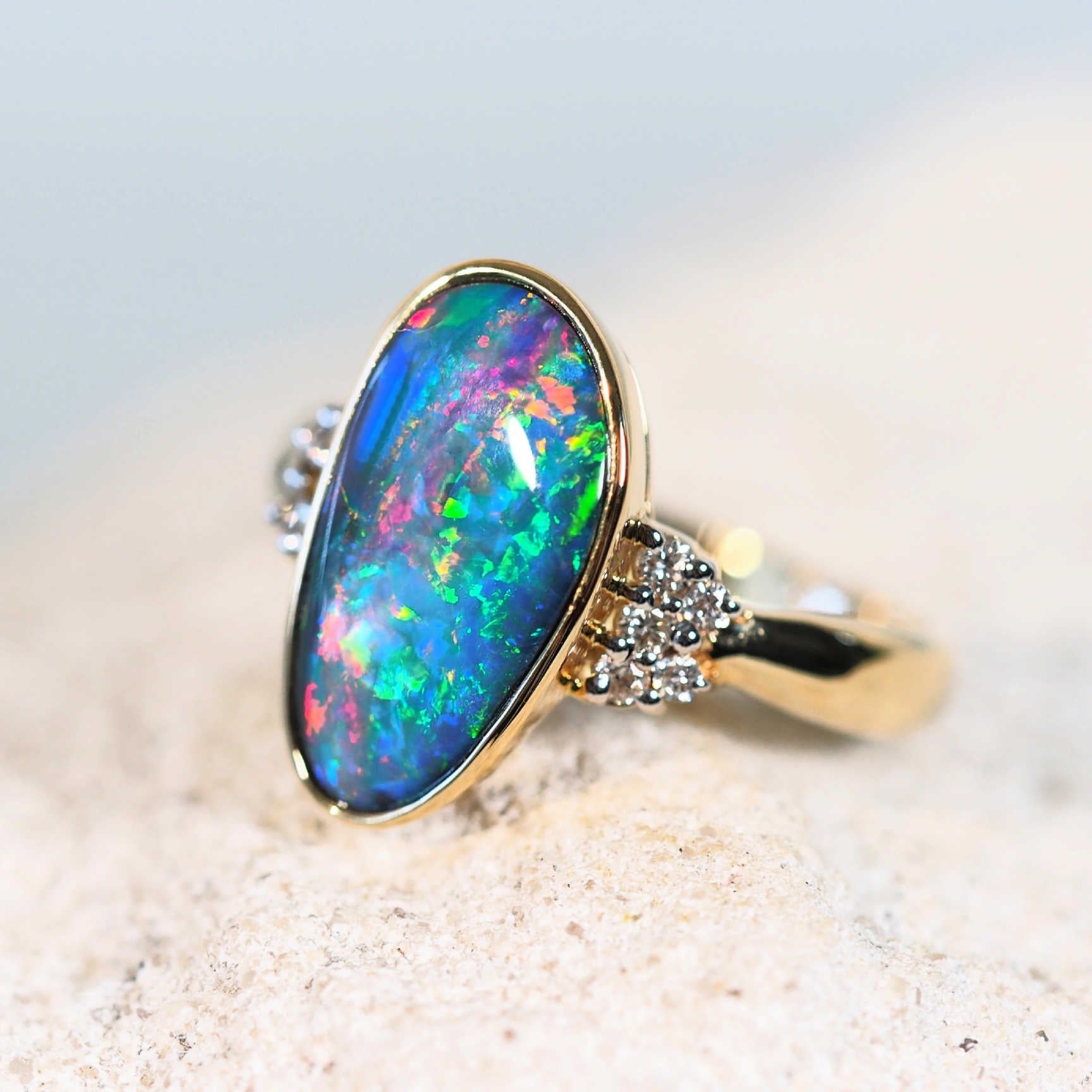 opal and diamond ring set in gold