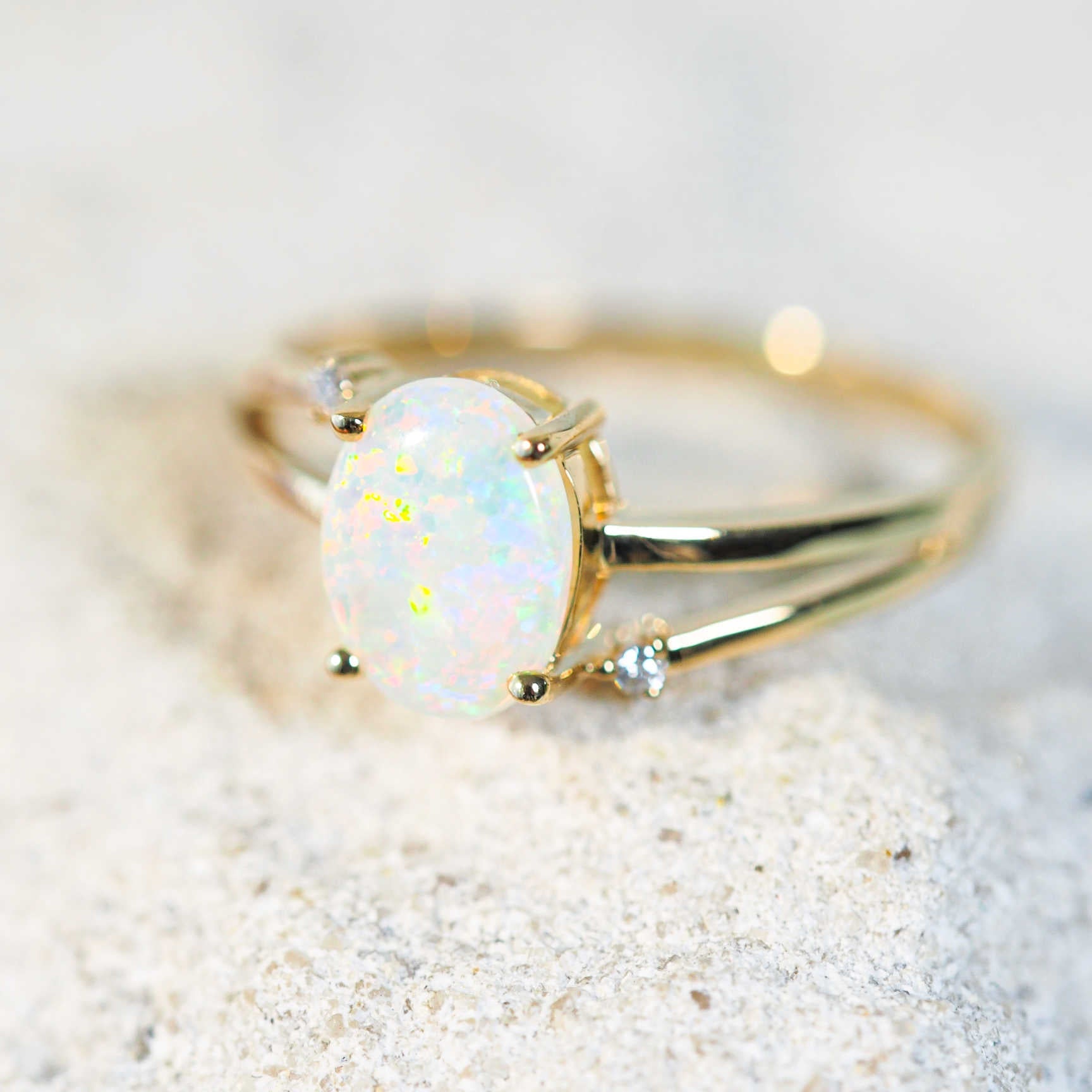 crystal opal ring set in yellow gold