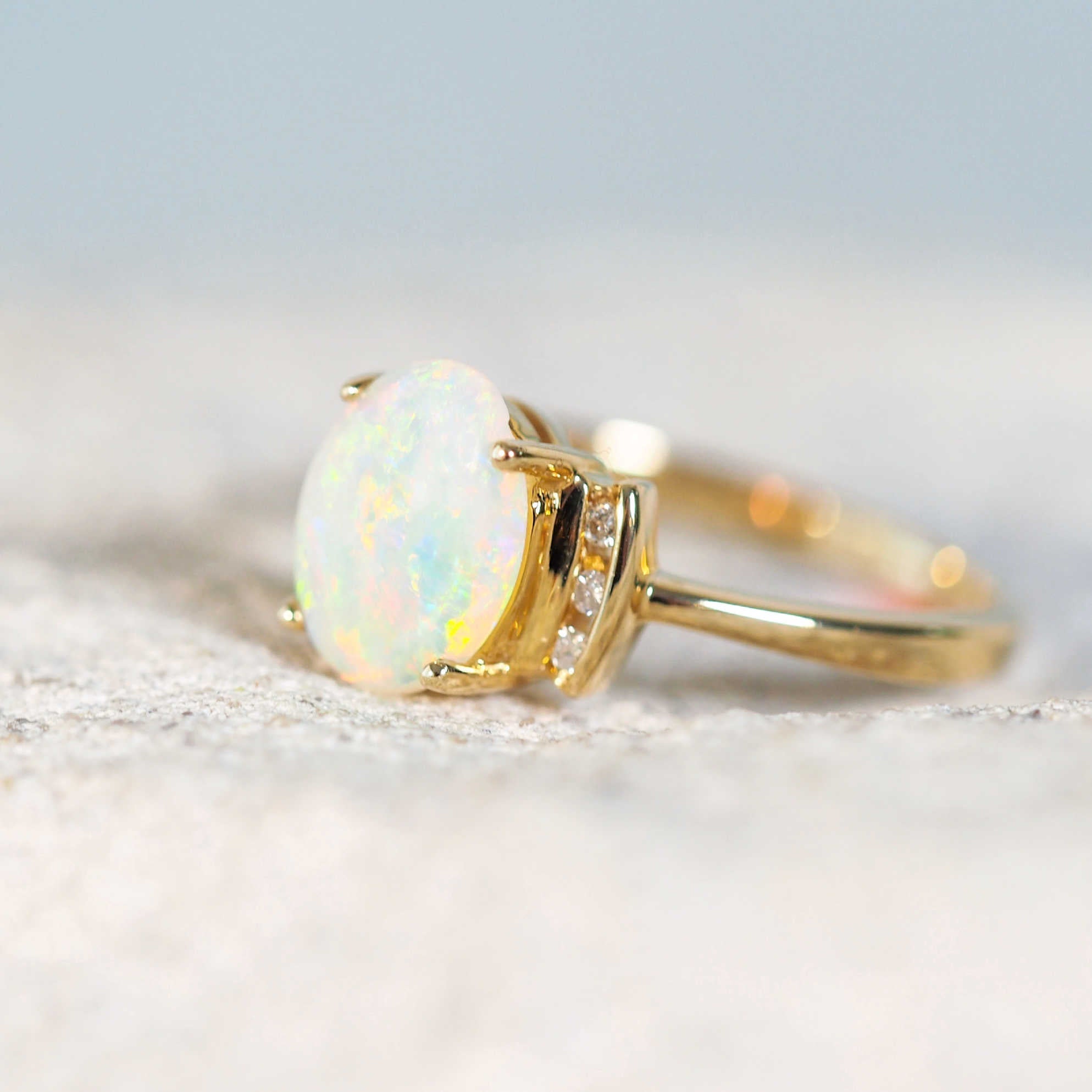 colourful gold opal ring with six diamonds