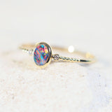 black opal ring set in 14ct yellow gold