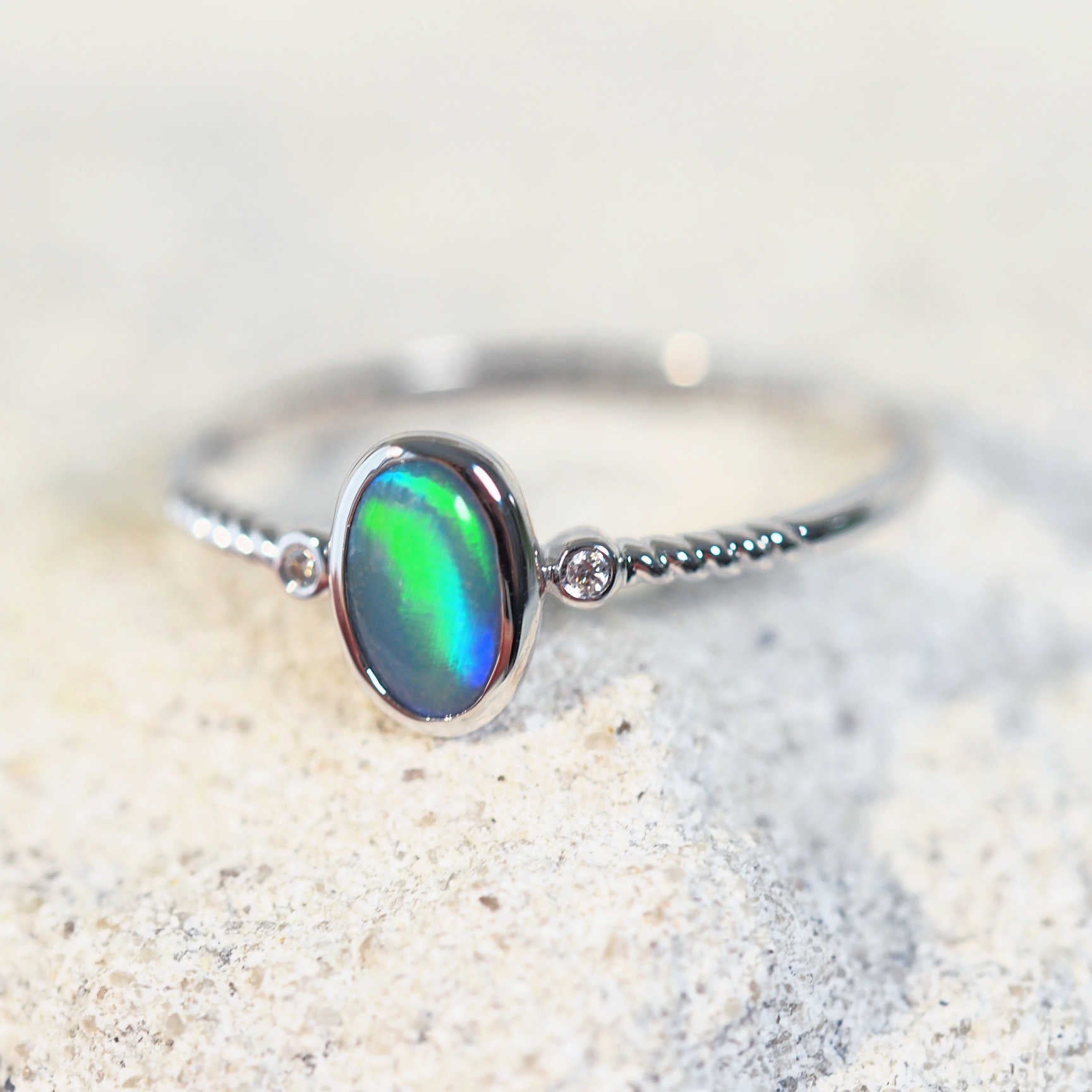 Green and blue coloured Lightning Ridge black opal ring