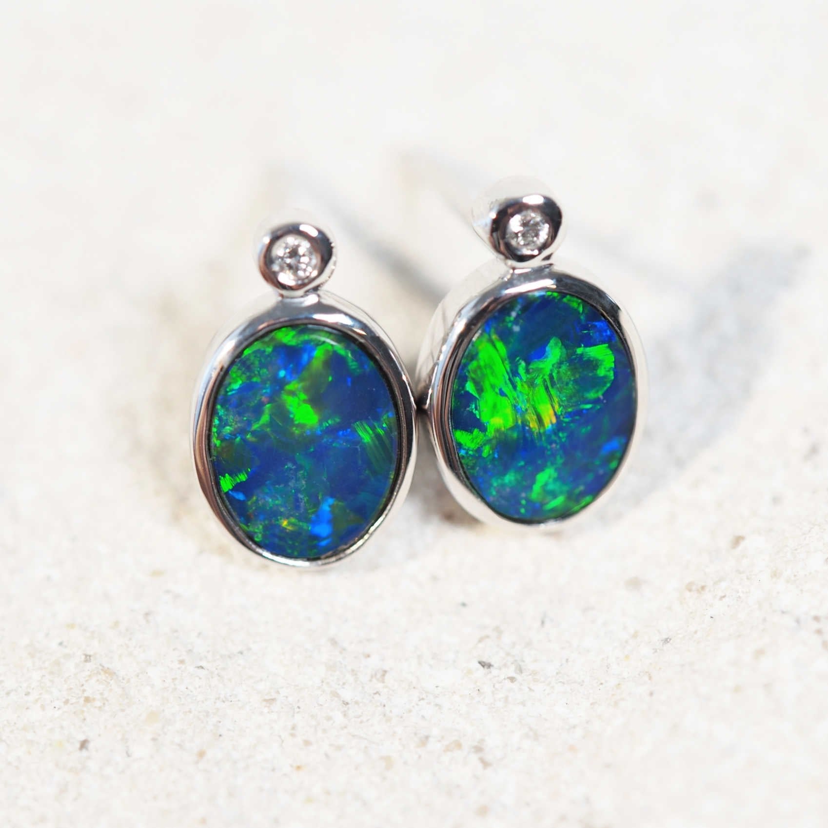 opal earrings set into white gold