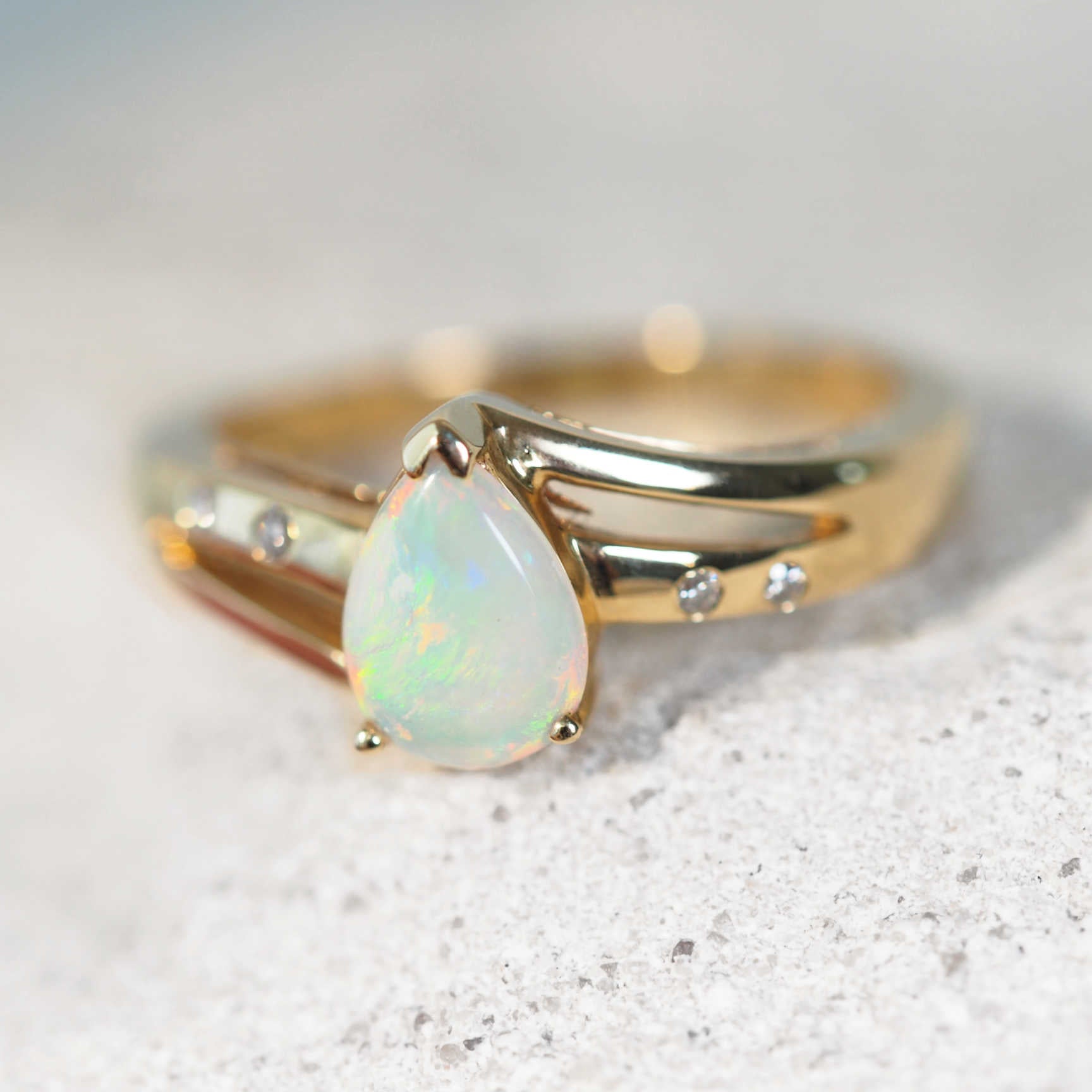 australian crystal opal gold ring with four diamonds