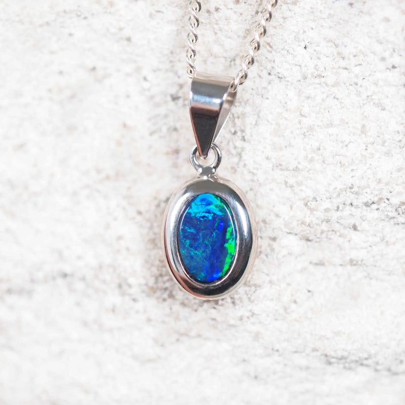 opal necklace set with a blue and green Australian gemstone in white gold