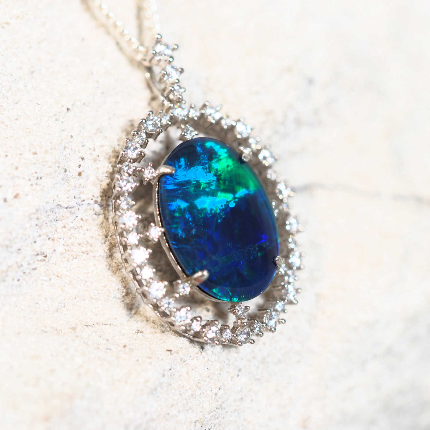 opal pendant set with a statement green and blue opal in silver