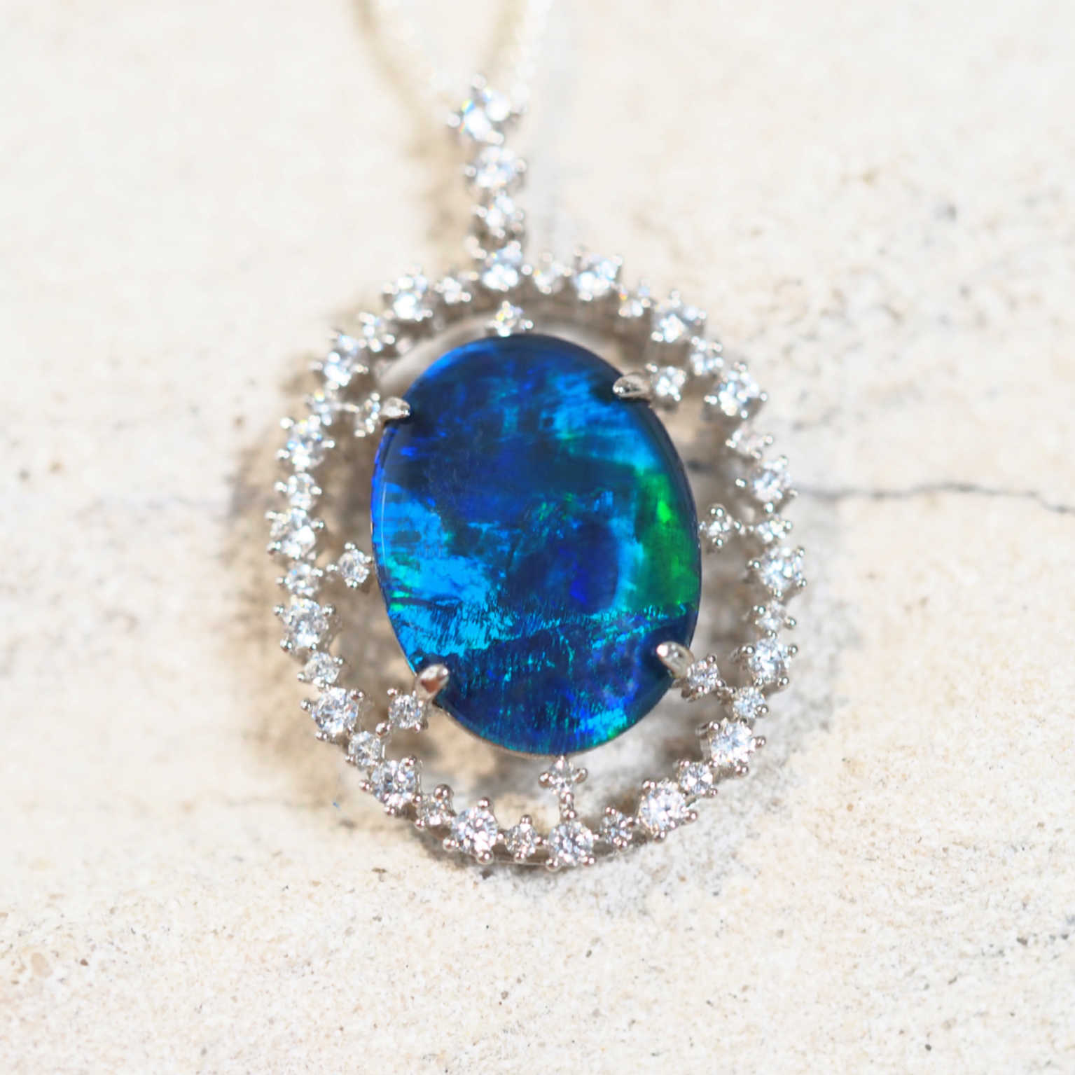 starlight design opal pendant set with a blue and green opal