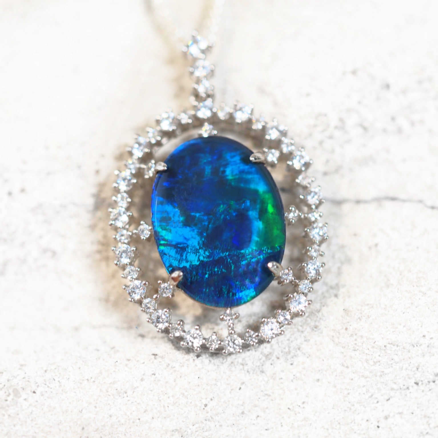 starlight design opal pendant set with a blue and green opal