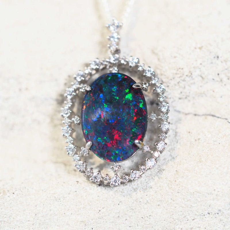 colourful opal pendant surrounded by 47 sparkling cubic zirconias