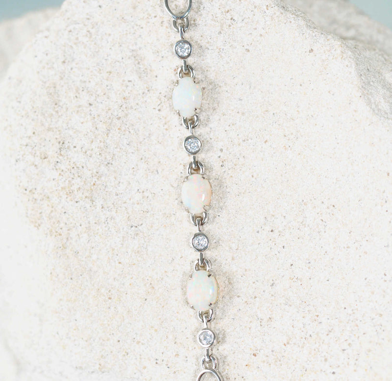 Starlight Trio opal bracelet showcasing vibrant oval-shaped opals and 10 sparkling crystals in a timeless sterling silver design