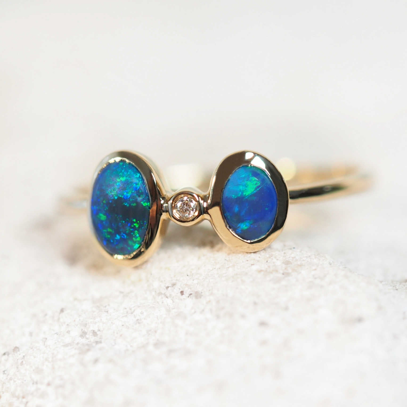 black opal ring set in 14ct yellow gold