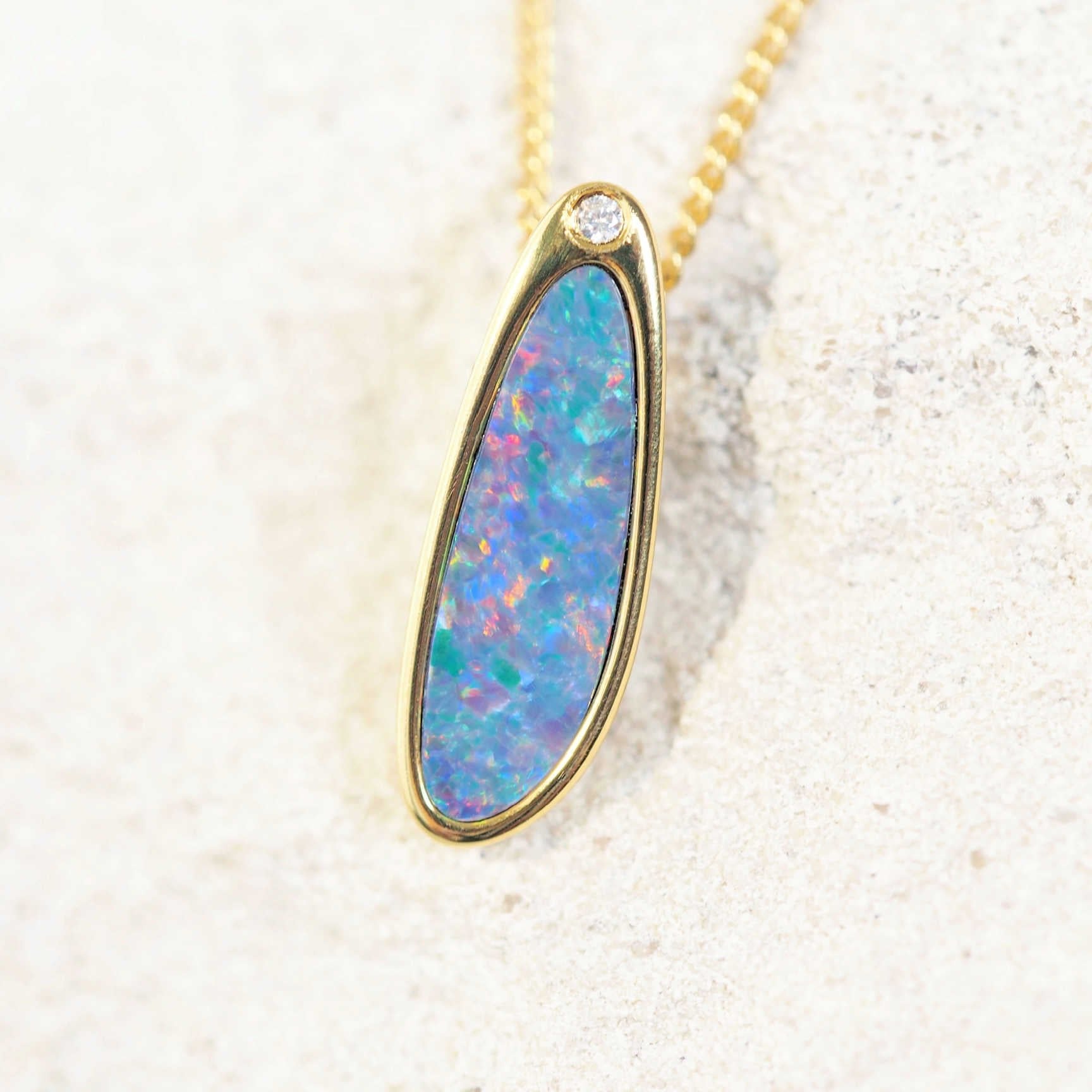 colourful opal gold plated silver pendant with one cubic zirconia