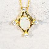 white opal pendant set on gold plated silver