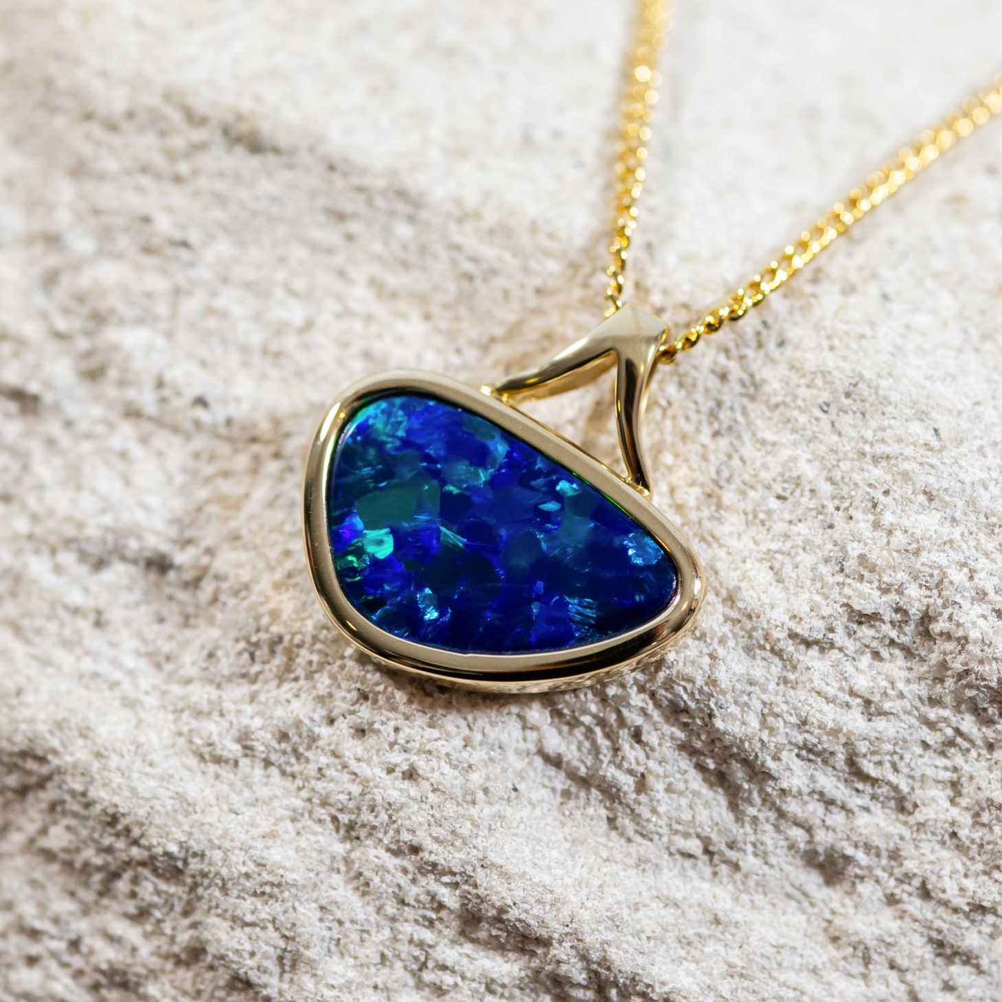 handcrafted gold blue, green and purple Australian doublet opal bezel set pendant