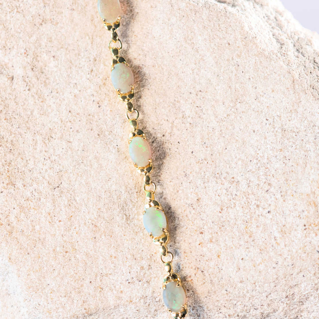 daisy chain white opal bracelet set in gold plated silver