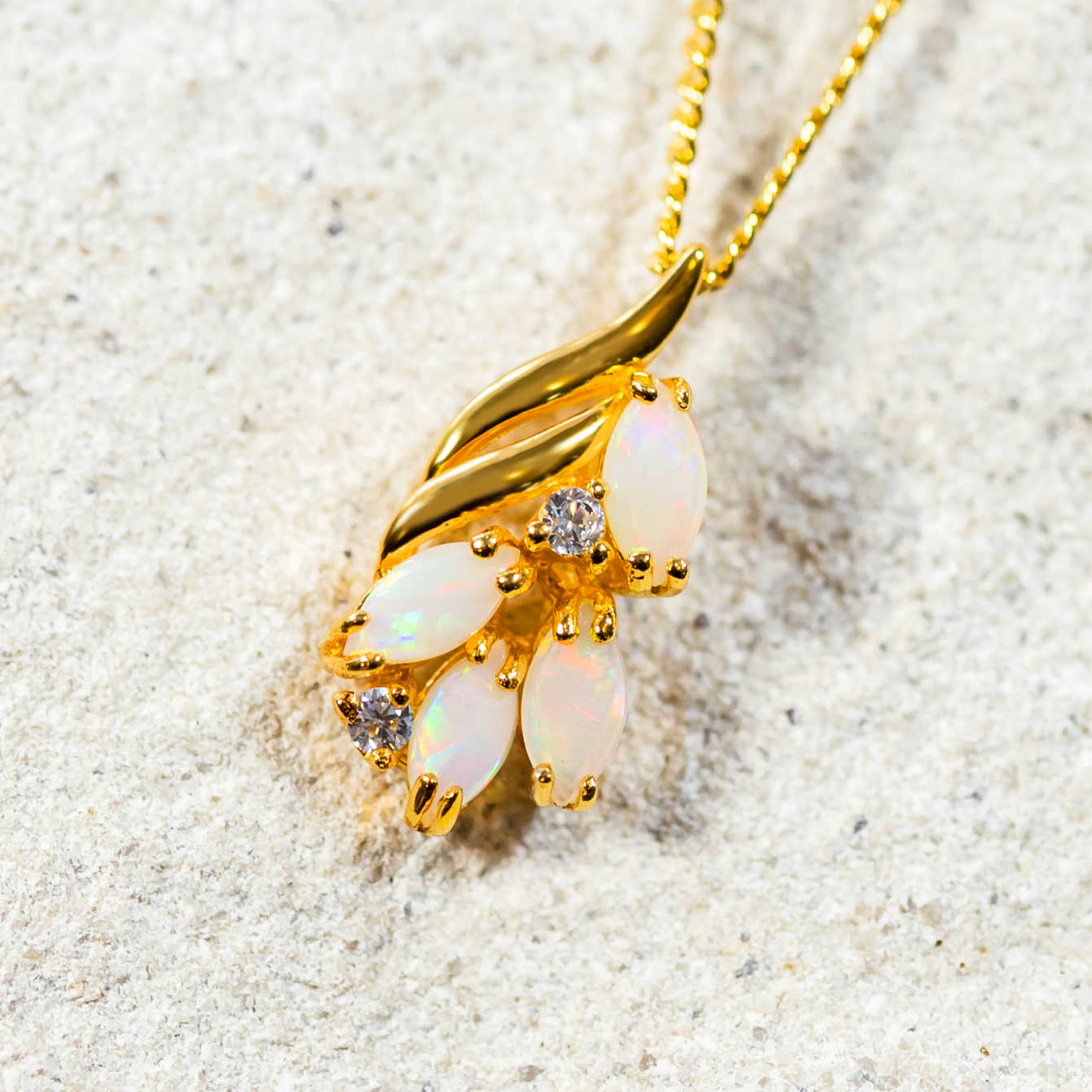 multi-colour australian crystal opals set into gold plated silver with two crystals