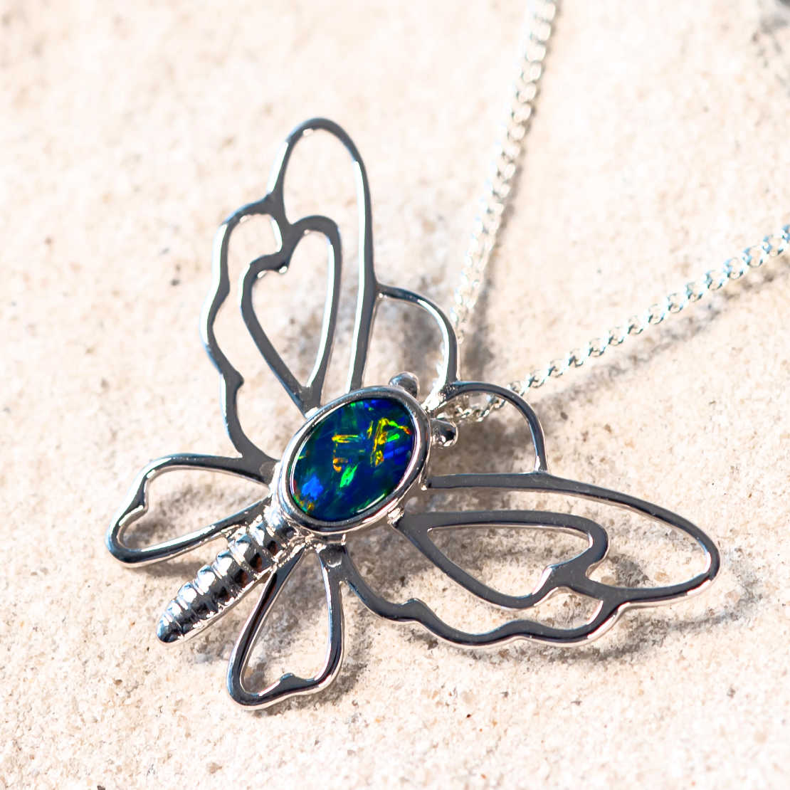 silver doublet opal pendant in a butterfly design